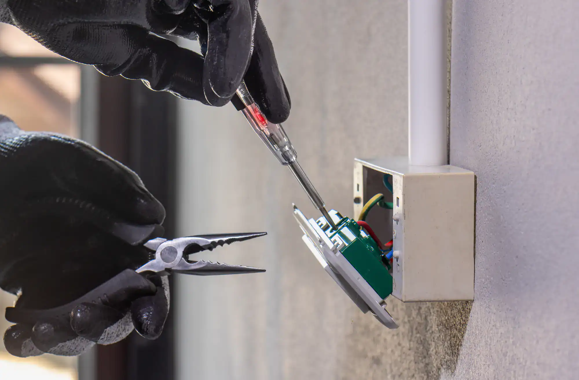 Electrician repairing a residential circuit breaker panel in a Dallas County home, ensuring safe and reliable electrical service